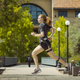 Stanford graduate student, Delaney Miller, wearing the energy expenditure monitoring system while running on campus